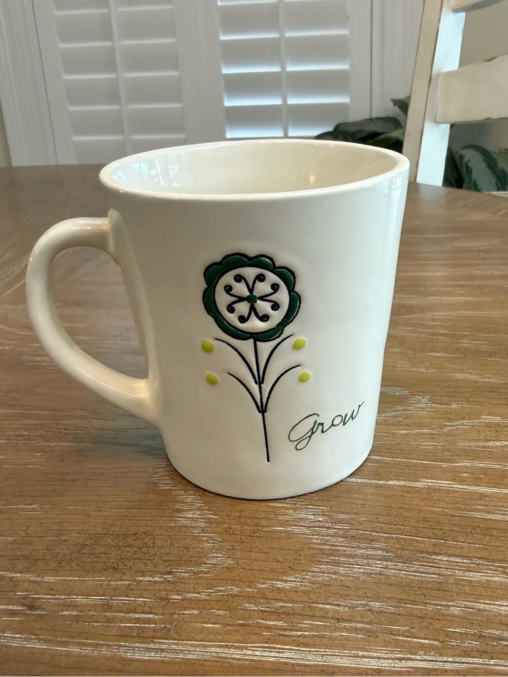 "grow" White Ceramic Mug with Green Flower Accent